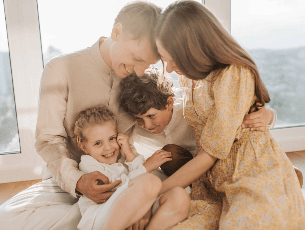Laughing family breathing clean air mother father and children