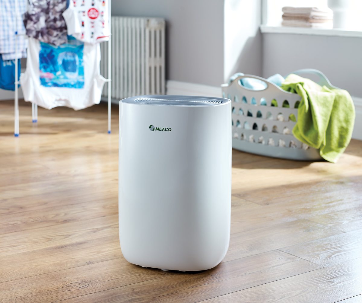 MeacoDry ABC Dehumidifier in living room with laundry set up to dry