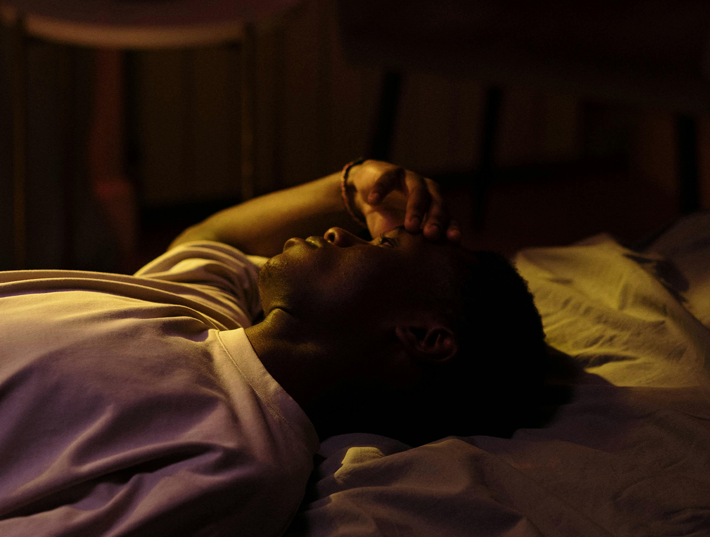 Man struggling to sleep in heatwave summer