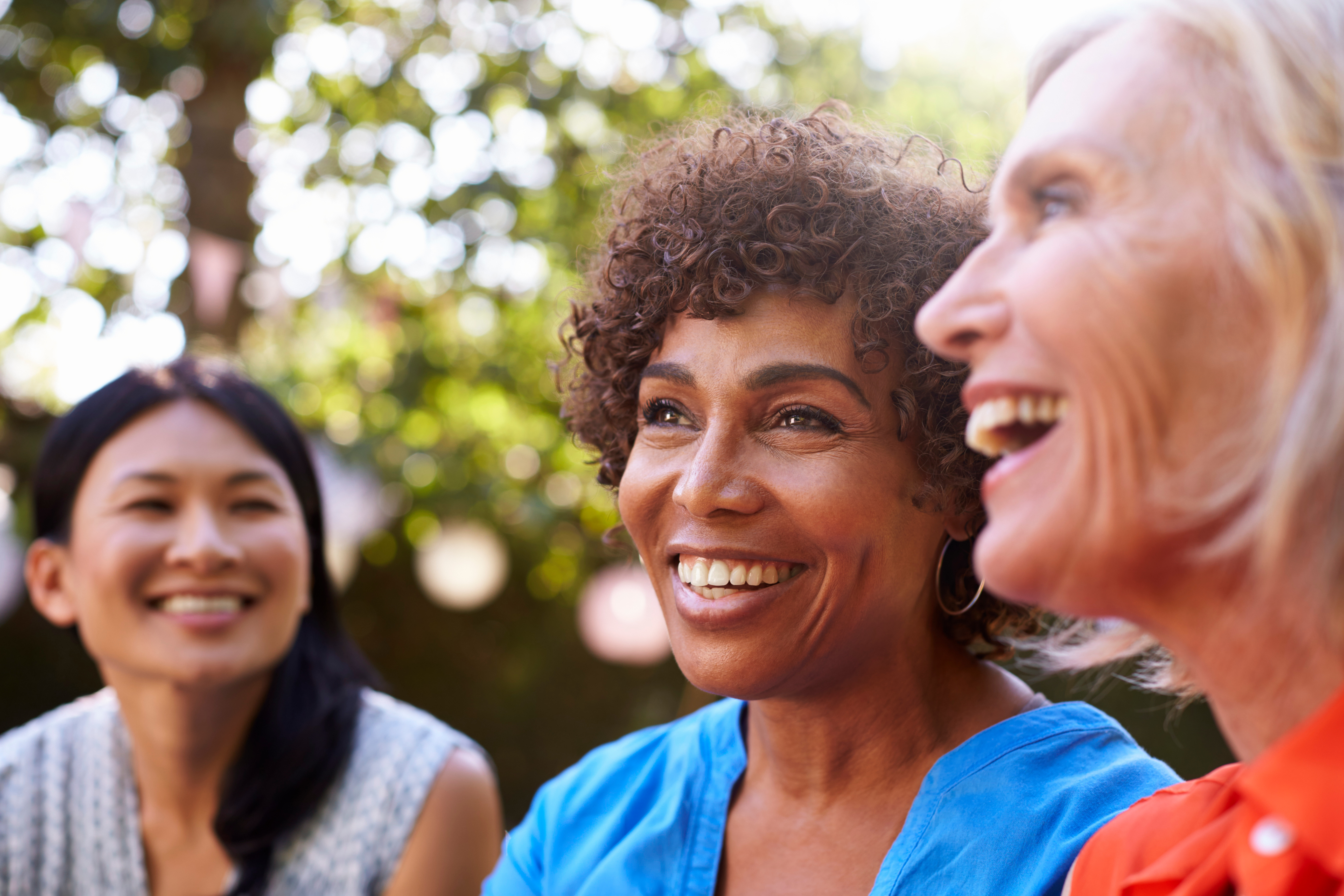 Three woman happy, socialising outside