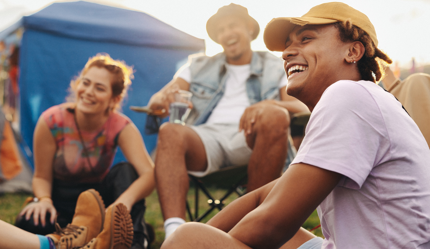 Friends enjoying a festival in the hot British summer (featured)