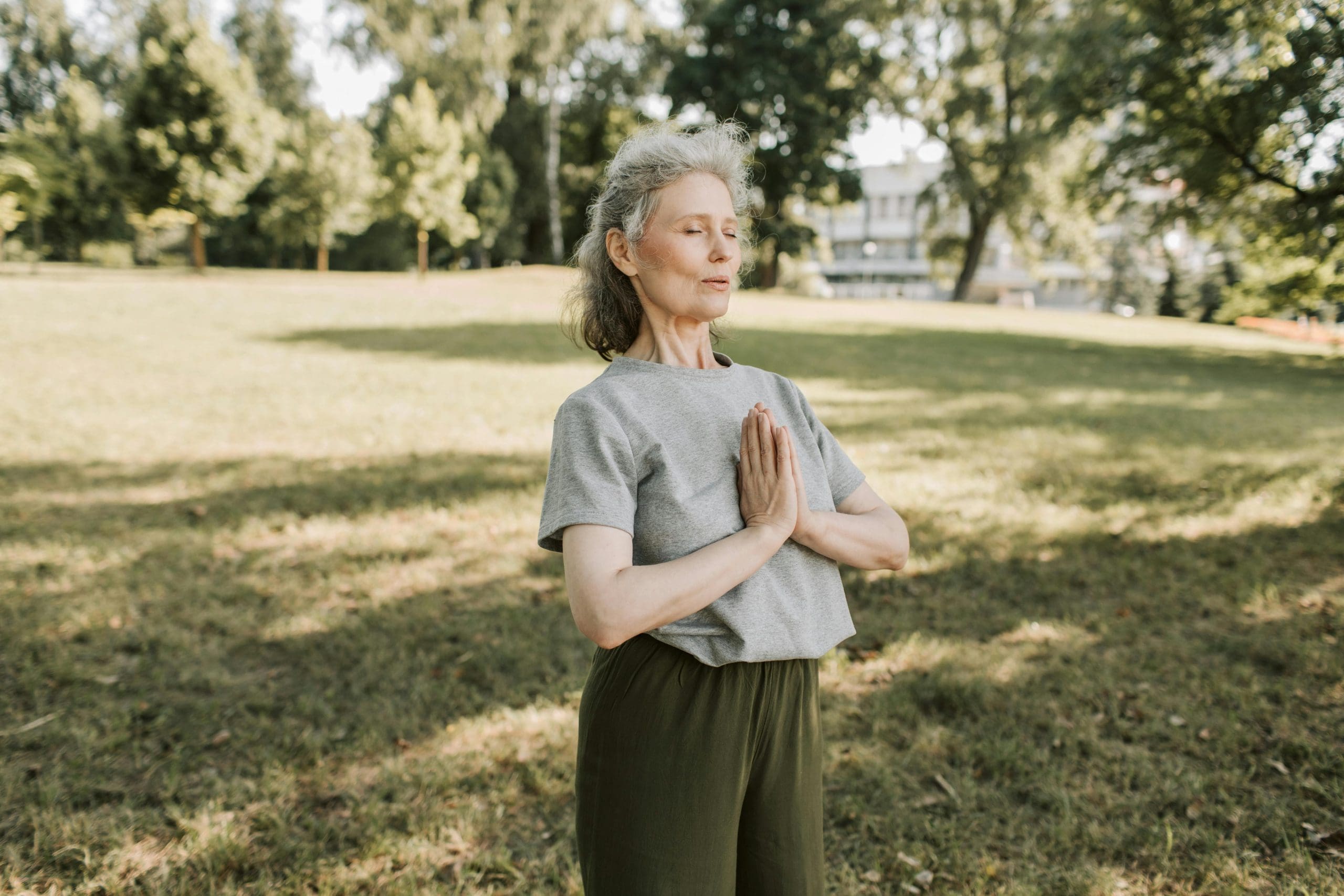Lady doing yoga in a park