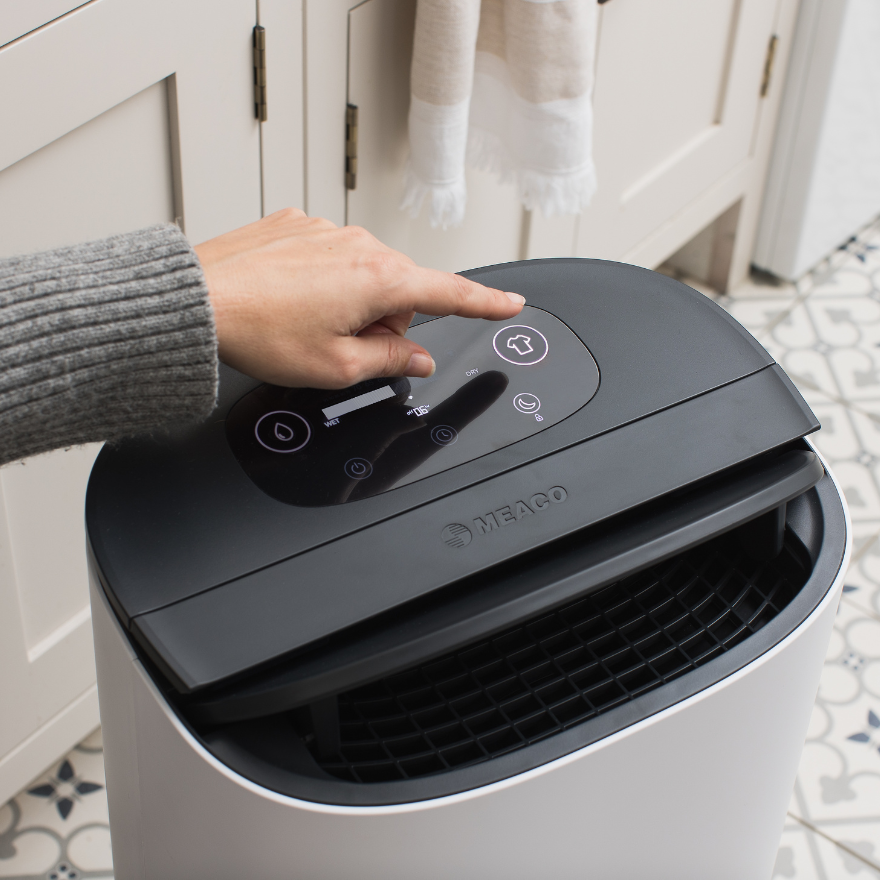 Arete Two 25L in utility room person about to click buttons