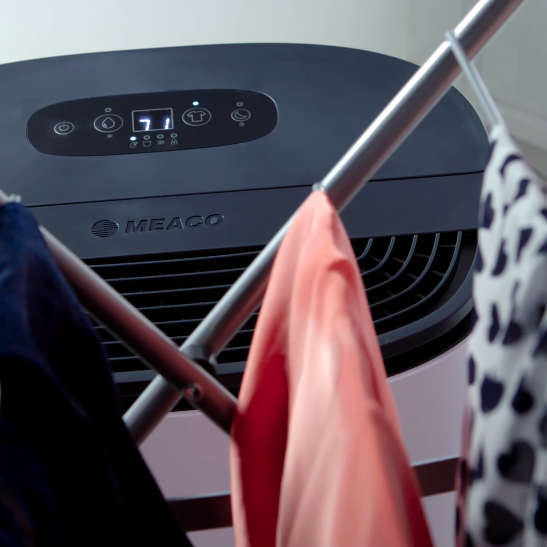 Dehumidifier next to laundry