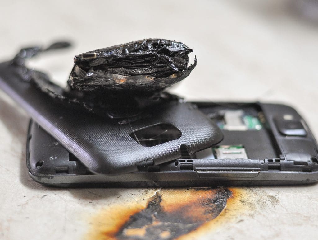 Mobile phone showing signs of a battery fire with melted casing