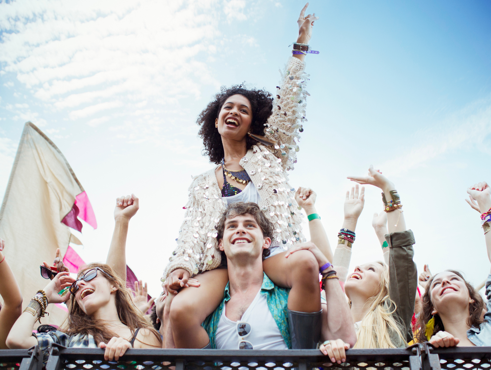 Music fans enjoying summer festival in the sun